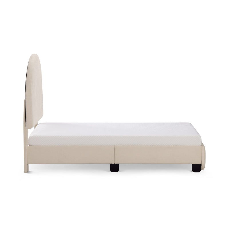 Side view of beige upholstered platform bed with tall fabric headboard and white mattress