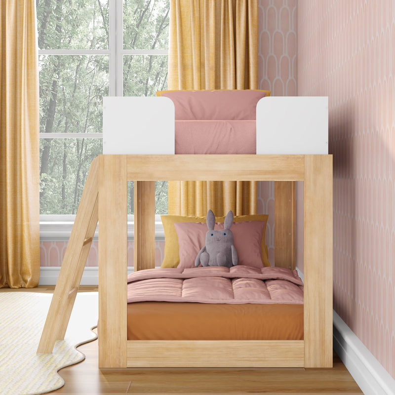 Kids' wooden bunk bed with pink and yellow bedding, plush bunny toy, patterned pink wallpaper and yellow curtains by window