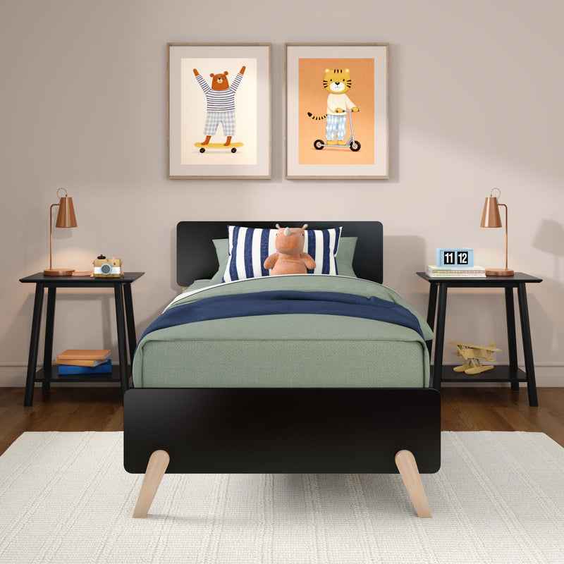 Modern children's bedroom decor: green bed with plush rhino and striped pillow, nightstands with lamps, framed animal wall art