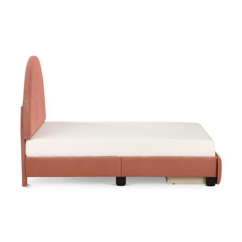 Side view of coral upholstered platform bed with rounded headboard, white quilted mattress and under-bed storage drawer