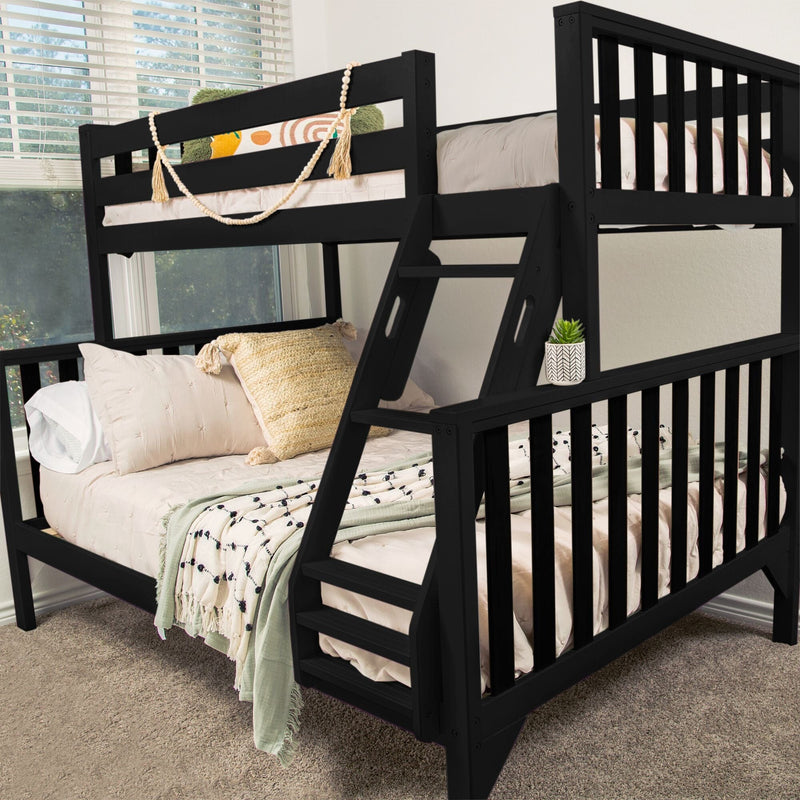 Black wooden twin-over-full bunk bed with angled ladder and guardrails, beige neutral bedding, textured throw pillows, decorative garland and succulent in a modern kids' bedroom
