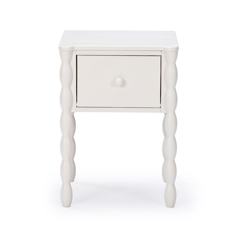 White wooden nightstand with single drawer and turned spindle legs, modern farmhouse bedside table on white background