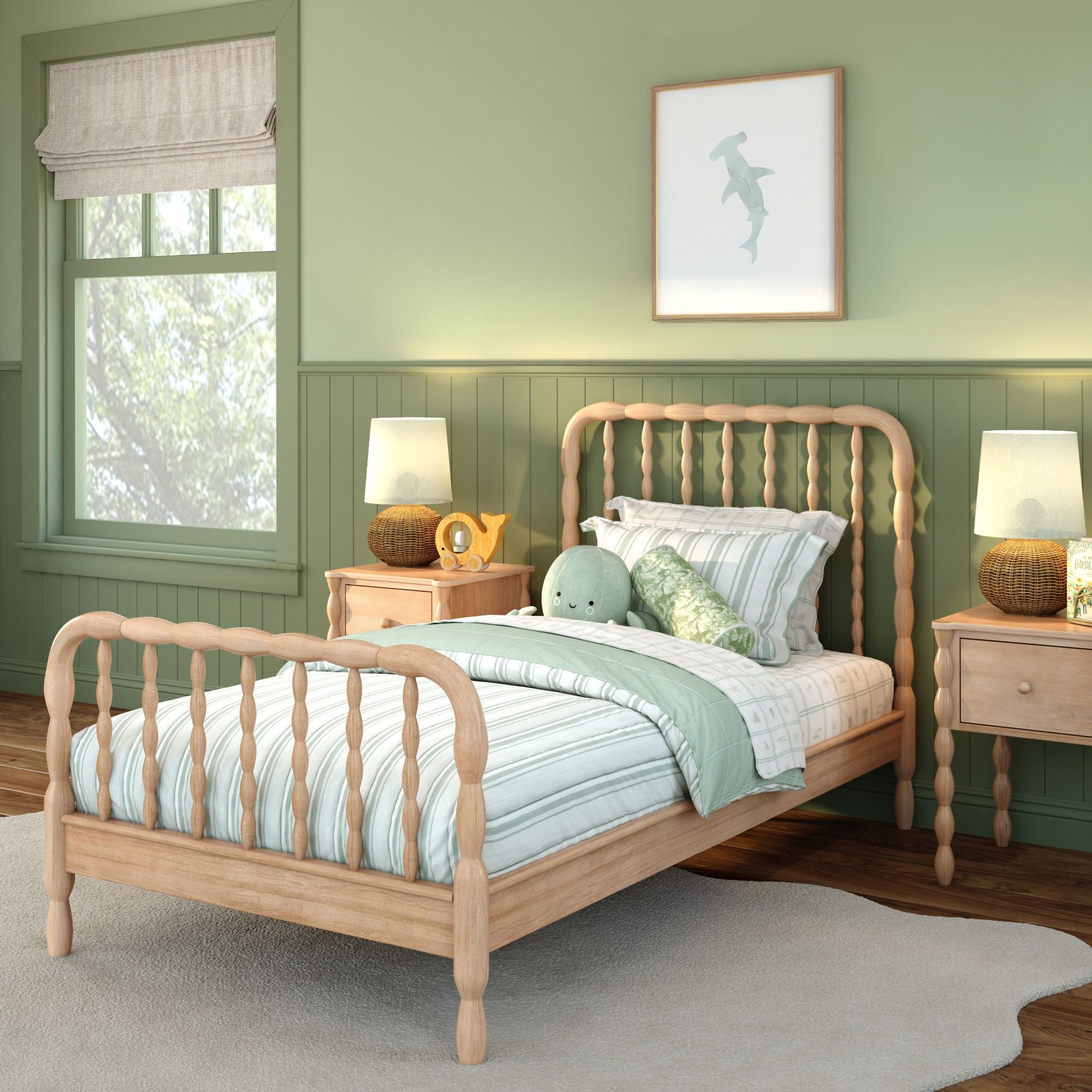 A light-wood finish Jenny Lind twin bed with green and white sheets in a green room. Matching nightstands are on either side of the bed.