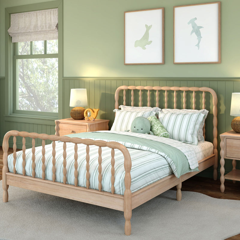 Cozy mint-green nursery with wooden spindle bed, striped mint bedding, plush octopus toy, natural wood nightstand and coastal animal wall art.