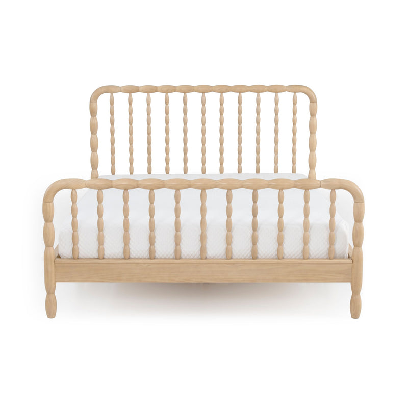 Light natural wood spindle bed frame with turned spindles headboard and footboard and white mattress, modern farmhouse wooden bed
