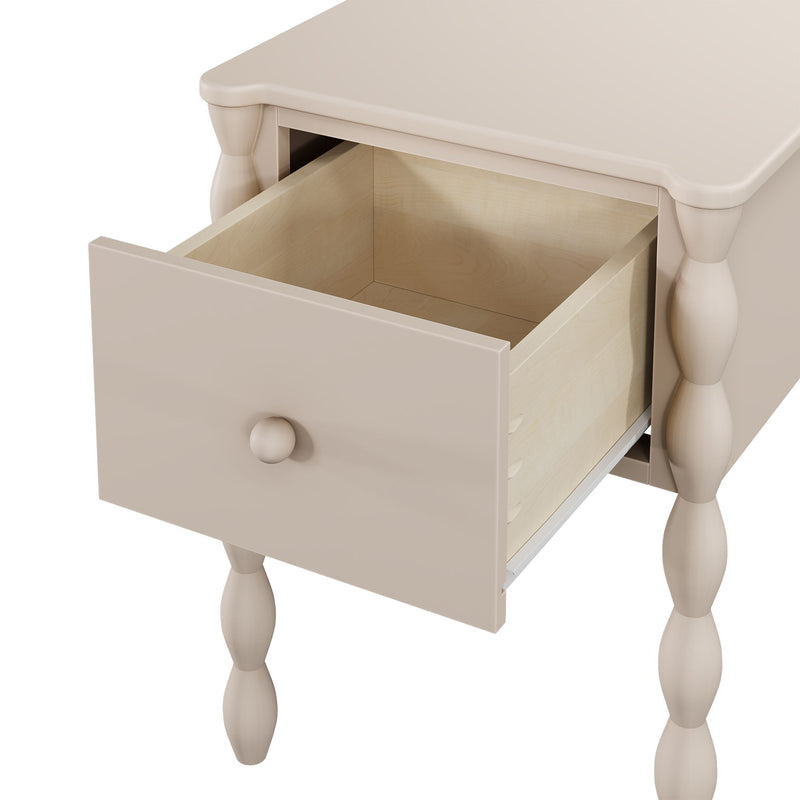 Beige wooden bedside table nightstand with turned legs, scalloped top edge and open drawer showing natural maple interior and round knob