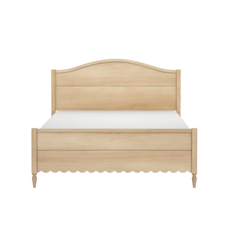 Light natural wood bed frame with curved headboard, scalloped footboard skirt and turned legs — cottage-style wooden bedroom furniture