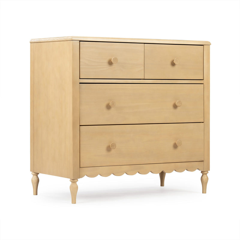 Light natural wood five-drawer dresser with round wooden knobs, scalloped apron and turned legs — classic bedroom storage chest of drawers