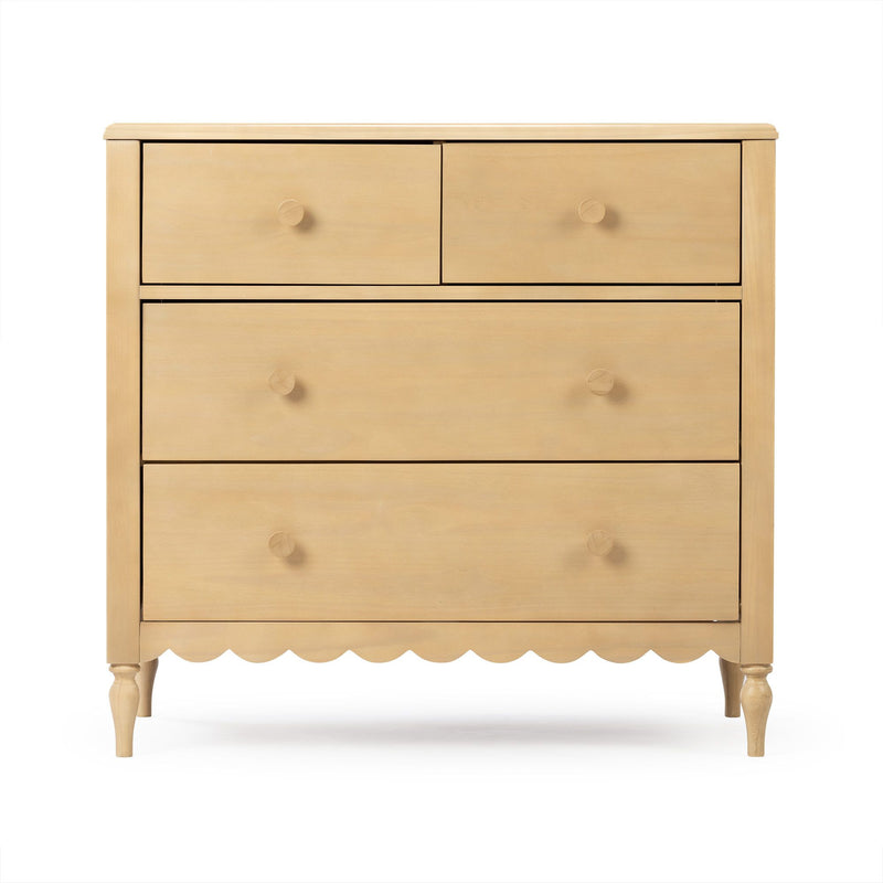 Natural light-wood chest of drawers with round knob pulls, scalloped apron and turned legs for bedroom storage