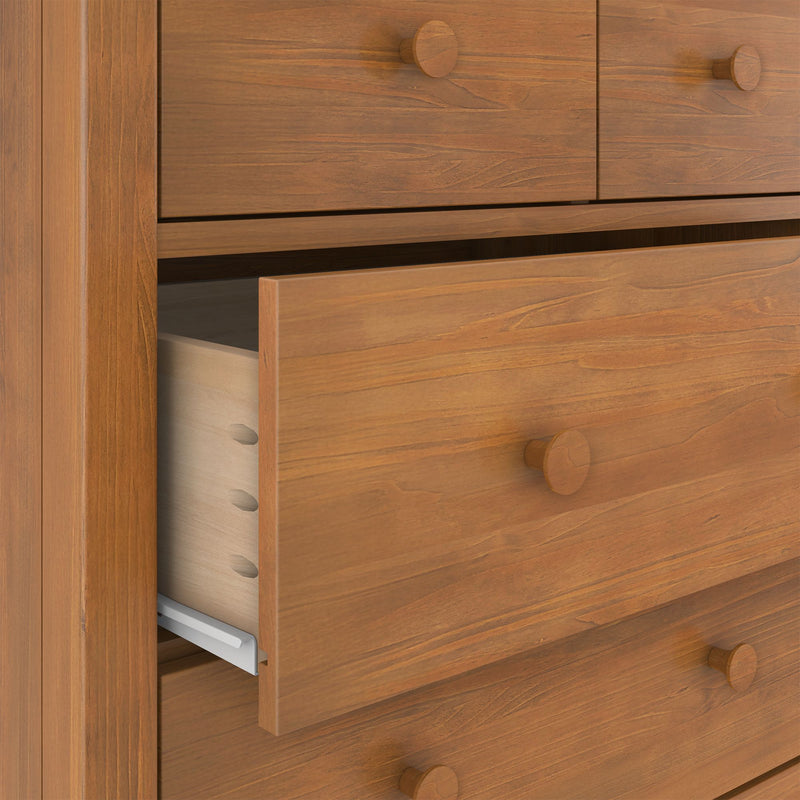 Solid wood dresser chest with open drawer, exposed dovetail joints, round wooden knobs and warm natural wood grain finish