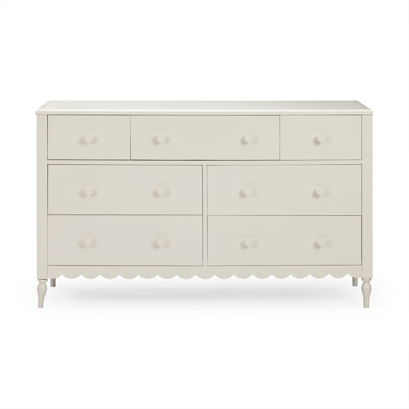 White painted wooden dresser with round knobs, scalloped apron and turned legs — multi-drawer bedroom storage furniture