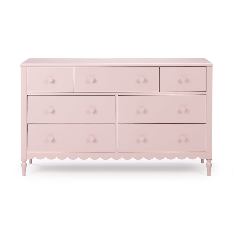 Pastel pink wooden six-drawer dresser with round knob handles and scalloped apron, nursery or kids' bedroom storage chest