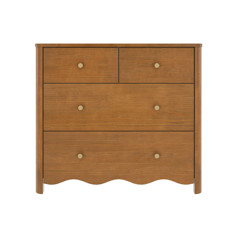 Mid-century modern brown wood dresser with natural finish and round brass knobs, close-up of chest of drawers showing scalloped apron and rounded legs