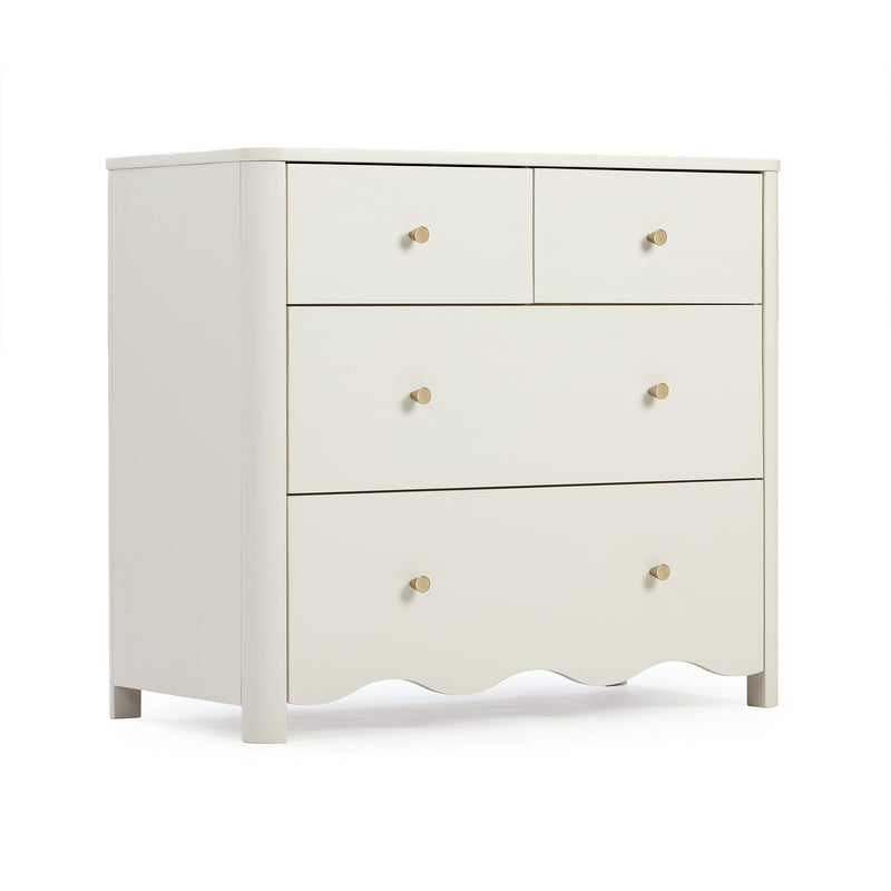 Cream white wooden dresser with brass knobs, scalloped apron and mixed-size drawers for nursery or bedroom storage