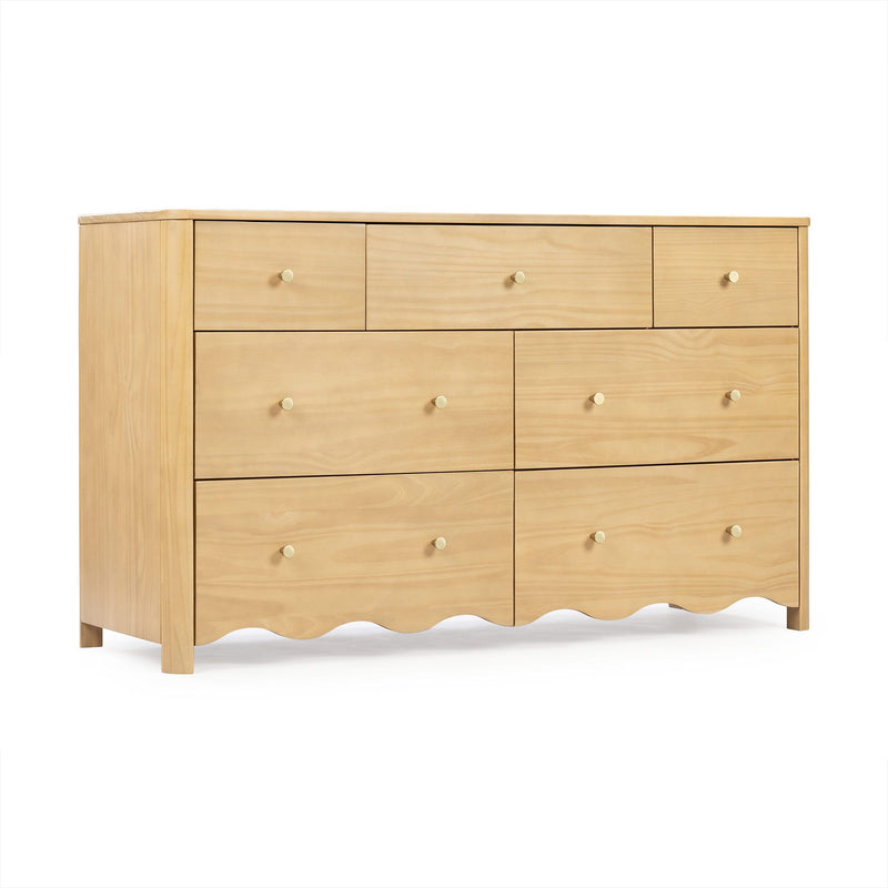 Light natural wood dresser with multiple drawers, round wooden knobs, scalloped base, minimalist bedroom storage furniture