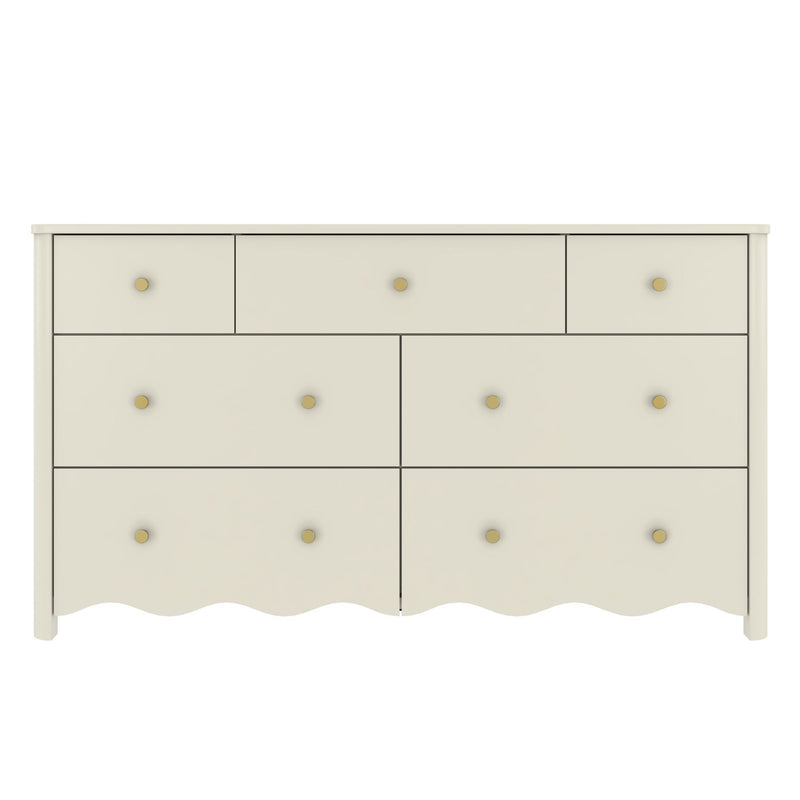 Off-white wooden dresser with multiple drawers, round brass knobs and scalloped base for bedroom storage