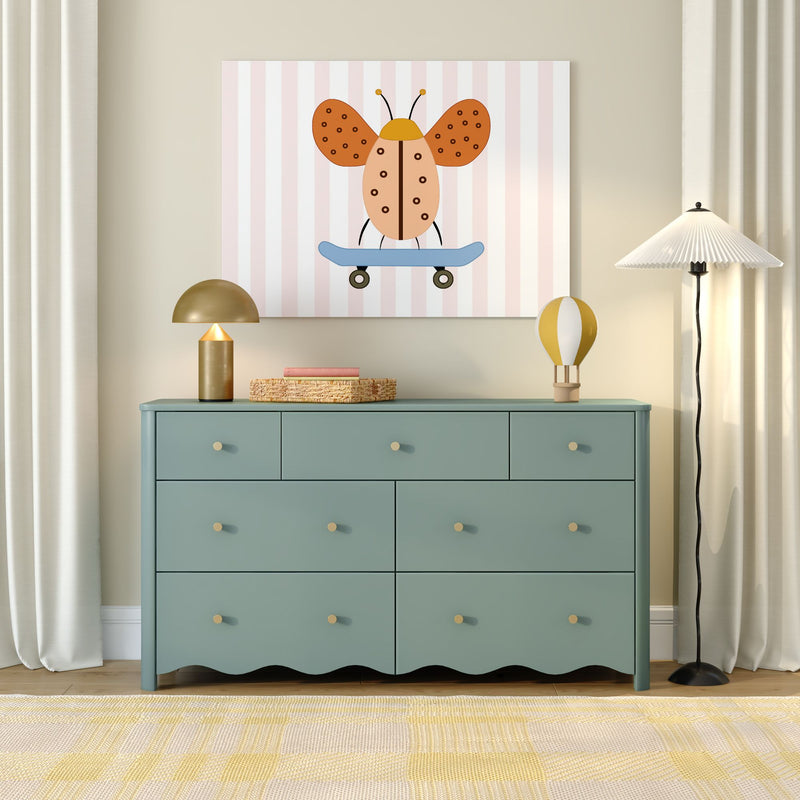 Nursery wall art: whimsical orange ladybug on a blue skateboard on a pastel pink-striped canvas above a teal dresser, children's room decor