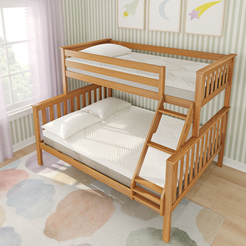 Twin-over-full wooden bunk bed with ladder and guardrails in children's bedroom, natural oak finish, white mattresses, pastel watercolor rug and green striped wallpaper