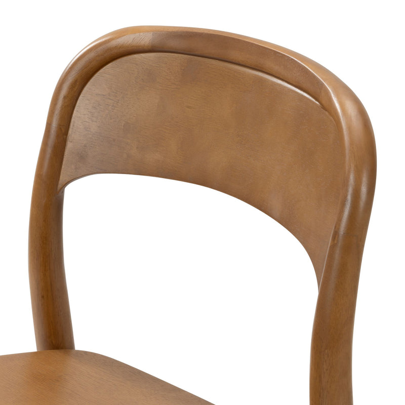 Wooden dining chair close-up showing curved backrest and seat in warm oak finish, mid-century modern solid wood design