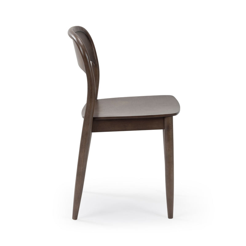Side view of a mid-century modern walnut dining chair with curved wooden backrest and brown wooden seat on a white background