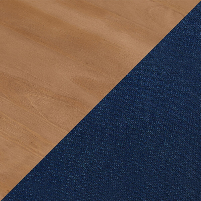 Close-up of light oak hardwood floor meeting navy blue textured carpet at a diagonal transition