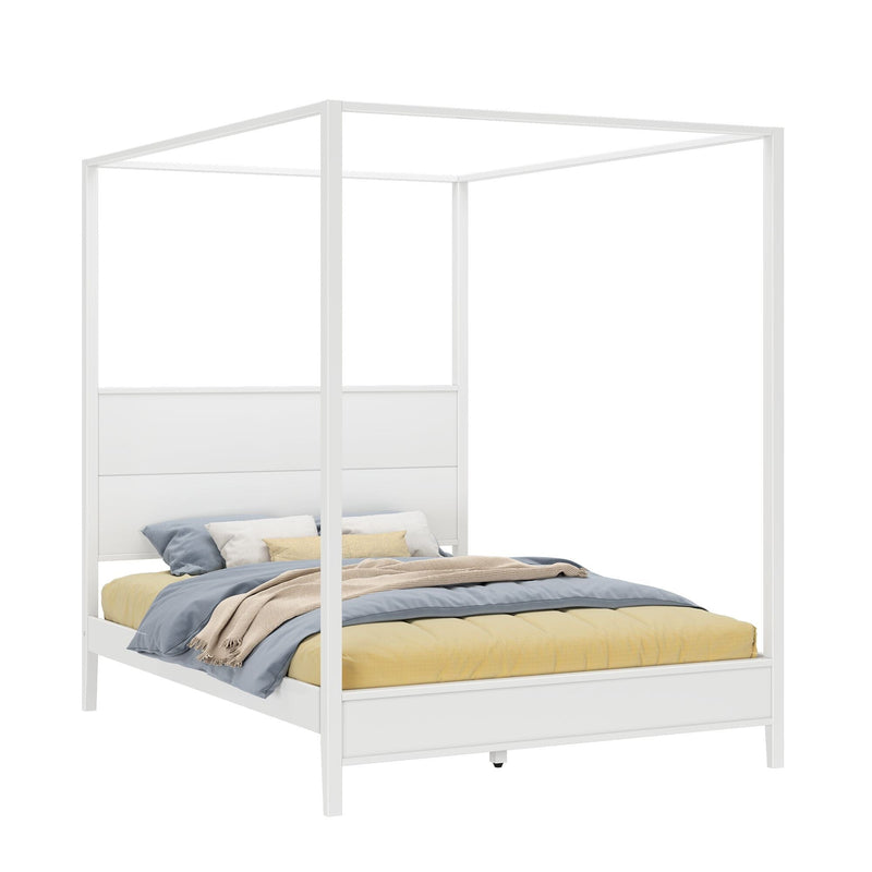 White four-poster canopy bed frame with panel headboard, layered blue and yellow bedding, beige throw and accent pillows