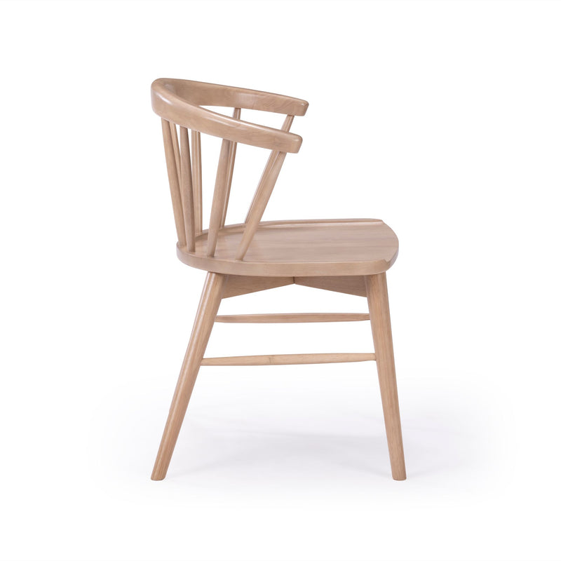 Modern Scandinavian spindle-back wooden dining chair in light natural wood finish with rounded backrest and tapered legs on white background