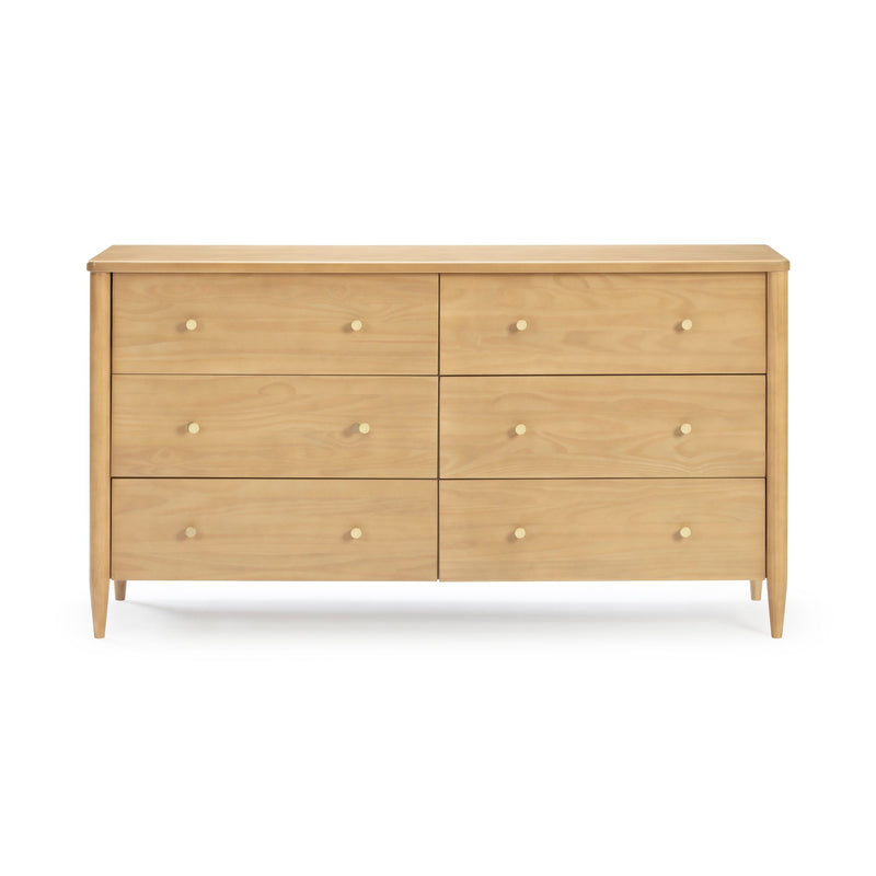 Mid-century modern six-drawer natural wood dresser with tapered legs and round brass knobs, bedroom storage