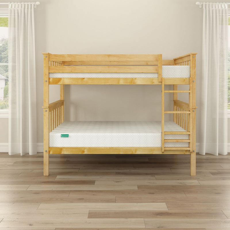Natural pine twin-over-full wooden bunk bed with ladder, slatted rails and white mattresses in bright minimalist bedroom with hardwood floor and sheer curtains