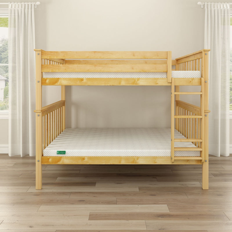 Solid pine wooden bunk bed with ladder and white mattresses in bright minimalist bedroom with light hardwood floors and sheer curtains