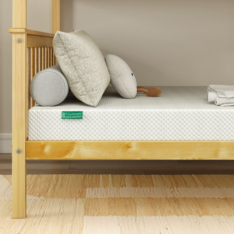 8-inch gel memory foam mattress with textured white cover on natural pine platform bed frame, styled with neutral pillows and beige area rug