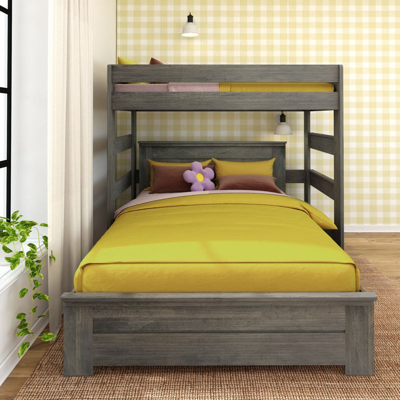 Gray wooden bunk bed with bright yellow bedding, pink and mustard pillows and flower plush, yellow gingham wallpaper and pendant lights in a kids' bedroom