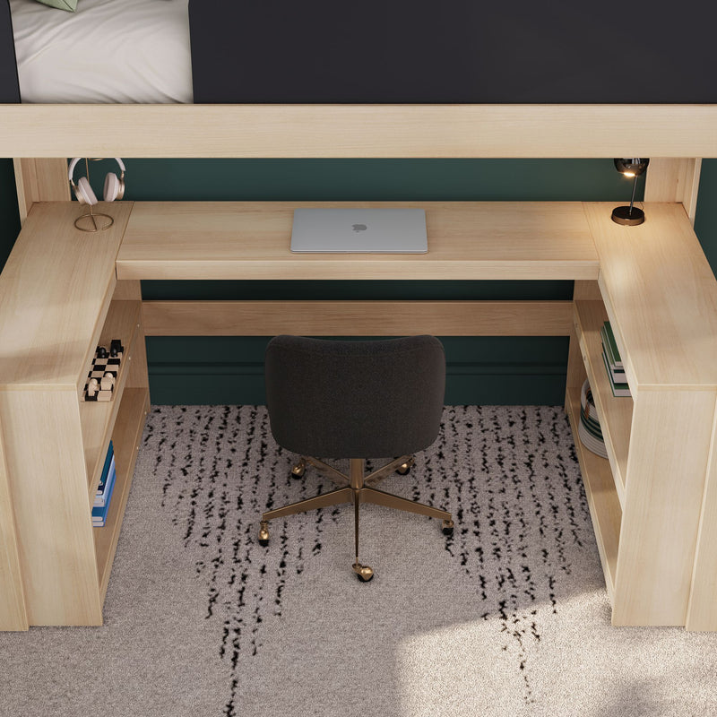 Modern loft bed with built-in wooden desk and shelves arranged as a compact home office with closed laptop, headphones on a stand, brass task lamp and swivel chair