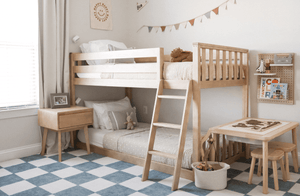 Blonde wood twin over twin bunk bed in kids bedroom