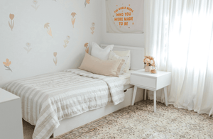 Kids white twin bed frame with storage and modern nightstand in neutral bedroom