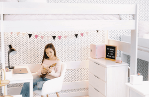 Solid wood high loft bed with shelf storage in shared boys room