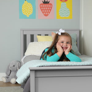 Grey platform bed frame in kids room