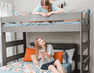 L shaped bunk bed in grey driftwood color in shared girls room