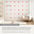 Pink watercolor polka dot wall decals arranged in a grid on an 8 ft x 10 ft nursery wall, shown with 18-inch center-to-center spacing, measurement arrows, neutral armchair, floating shelves and window for a DIY wallpaper-style decal layout