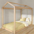 Natural light wood house-shaped canopy kids bed with yellow bedding, plush letter A pillow on toddler floor bed in modern nursery
