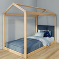 Montessori-style wooden house-frame twin bed with blue bedding, striped sheets and plush letter "A" in a minimalist kids' bedroom