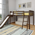 Wooden loft bed with slide in a children's bedroom with yellow bedding, gray curtains, striped rug and framed cat wall art