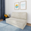 Minimalist living room with beige textured sofa, blue area rug, navy curtains, coastal sun and shaka framed wall art, and wire basket of yellow striped throw pillows.