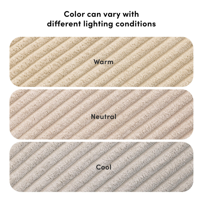 Beige plush ribbed towel swatches labeled Warm, Neutral, Cool under heading "Color can vary with different lighting conditions" showing lighting-dependent color variation