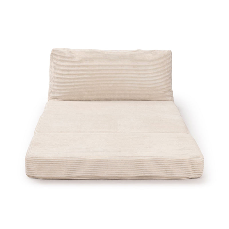 Beige ribbed corduroy lumbar cushion and matching seat pad on modern chaise lounge for living room decor