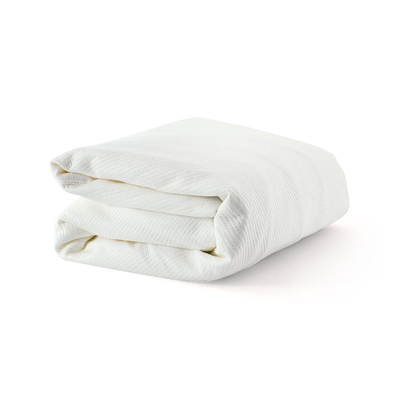 Folded white blanket on plain background, perfect for cozy home decor and bedding.
