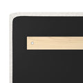 Upholstered beige headboard back with wooden hanging cleat and metal mounting screw on black backing, headboard mounting hardware detail