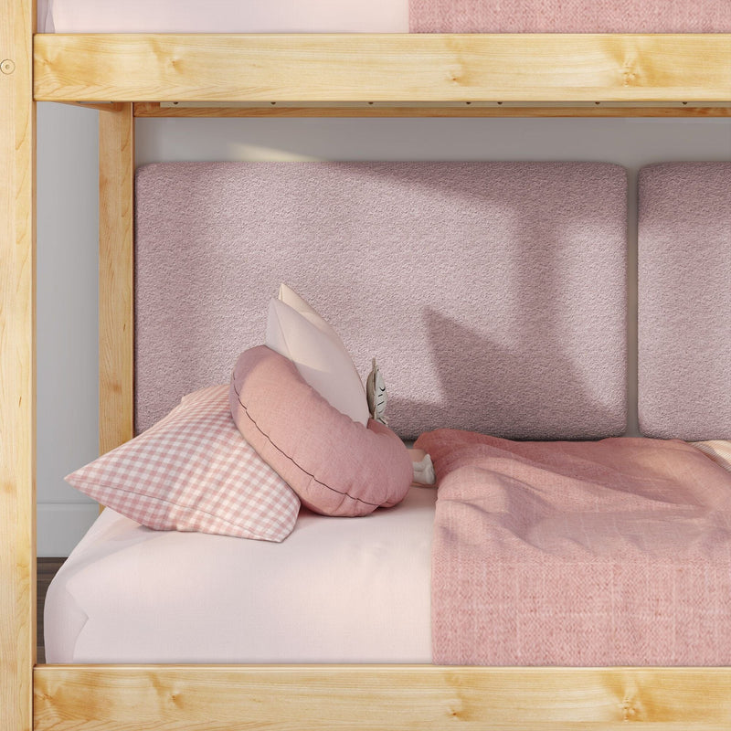 Cozy pink children's bunk bed with natural wood frame, soft pink bedding, gingham pillow and round decorative cushions — kids bedroom decor