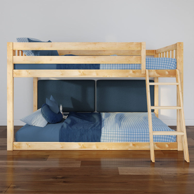 Natural pine wooden bunk bed with ladder and blue gingham and solid bedding against a white wall in a modern kids' bedroom