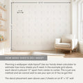 Nursery wall decal layout on 8 ft x 10 ft wall showing ghost-shaped vinyl decals in a 12-inch grid, light-filled room with armchair and shelves